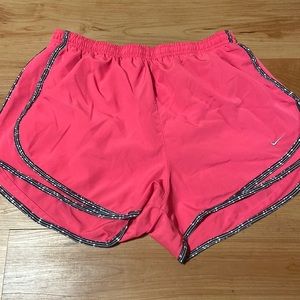 Pink, with black and white outline nike dri-fit sport shorts